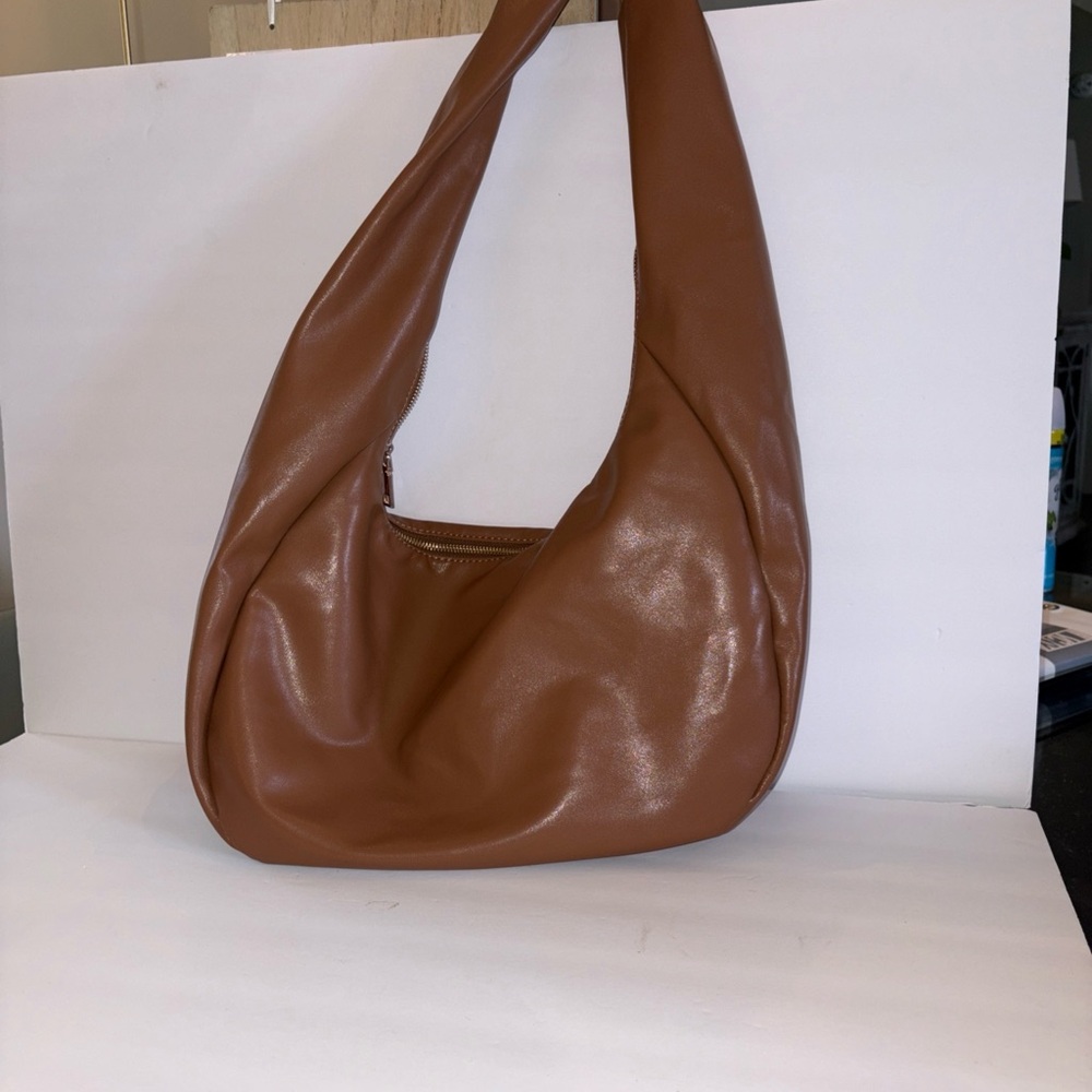 Anthropology large tan Tote Gold hardware Inner zip pocket 13 1/2” Length 9”high